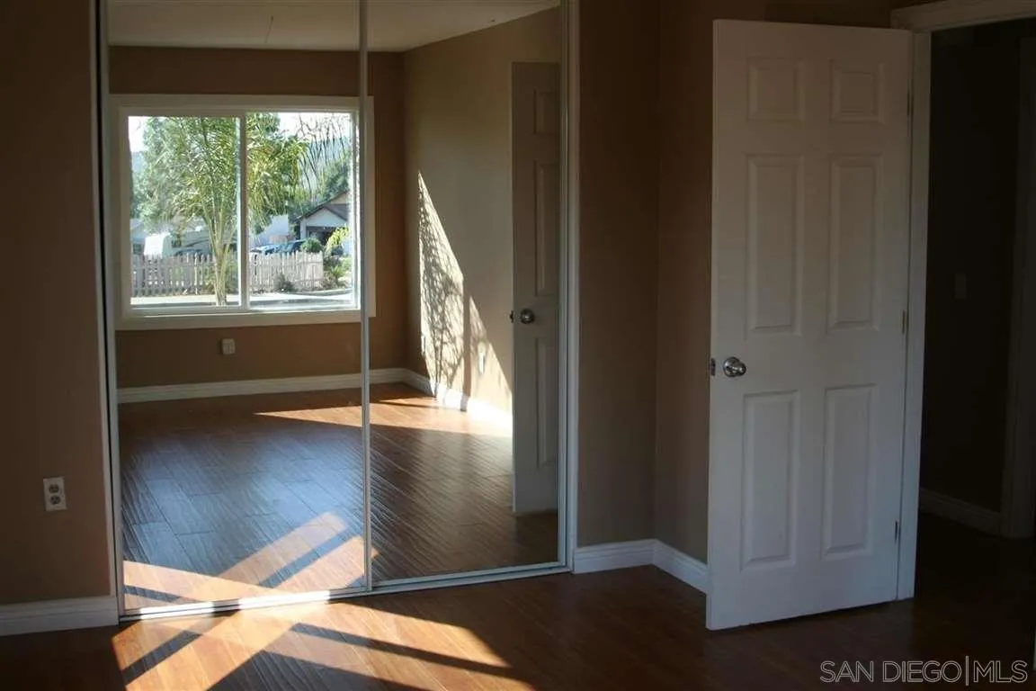 13605 Acton Avenue Poway, CA 92064 - Photo 6 of 18 a view of empty room with wooden floor and fan