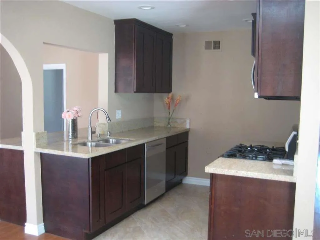 13605 Acton Avenue Poway, CA 92064 - Photo 9 of 18 a kitchen with a sink and cabinets