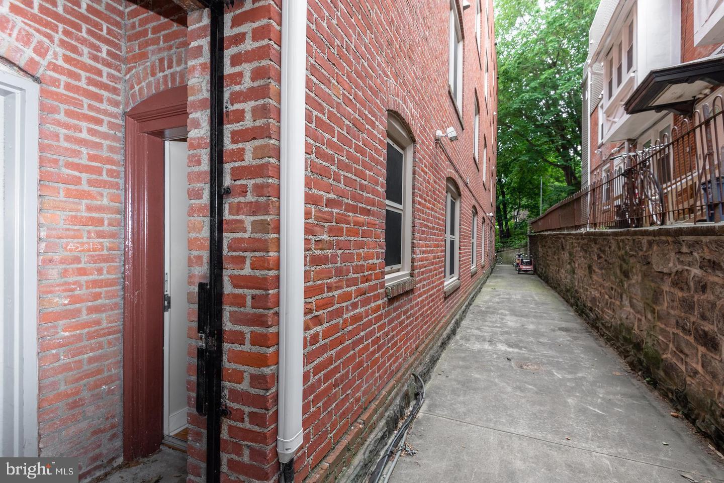 4300 Spruce Street, Unit A102 Philadelphia, PA 19104 - Photo 10 of 16 a view of a pathway with a building in the background