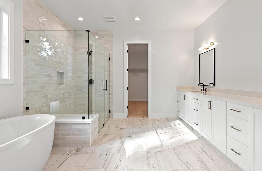 10567 John Way Cupertino, CA 95014 - Photo 8 of 11 a bathroom with a double vanity sink a large mirror a shower and bathtub