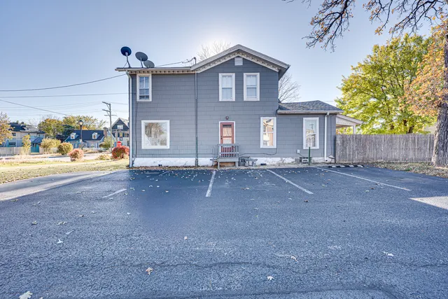 a view of a house with a street