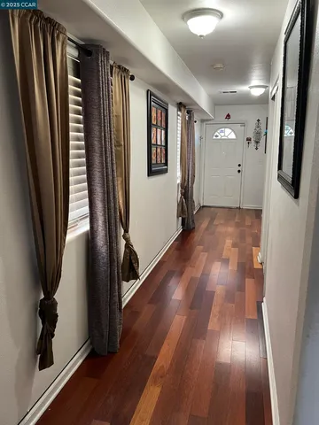 a view of entryway with wooden floor