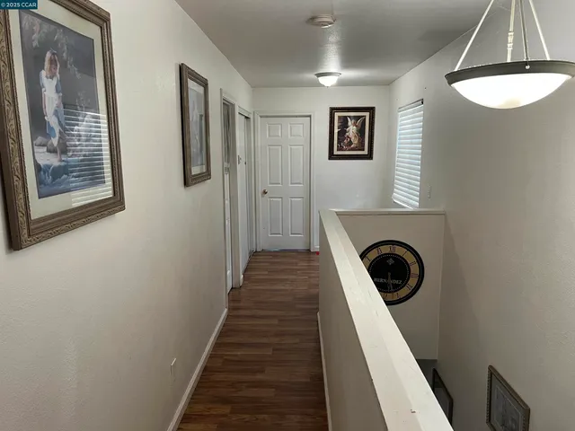 a view of a hallway with washer and dryer