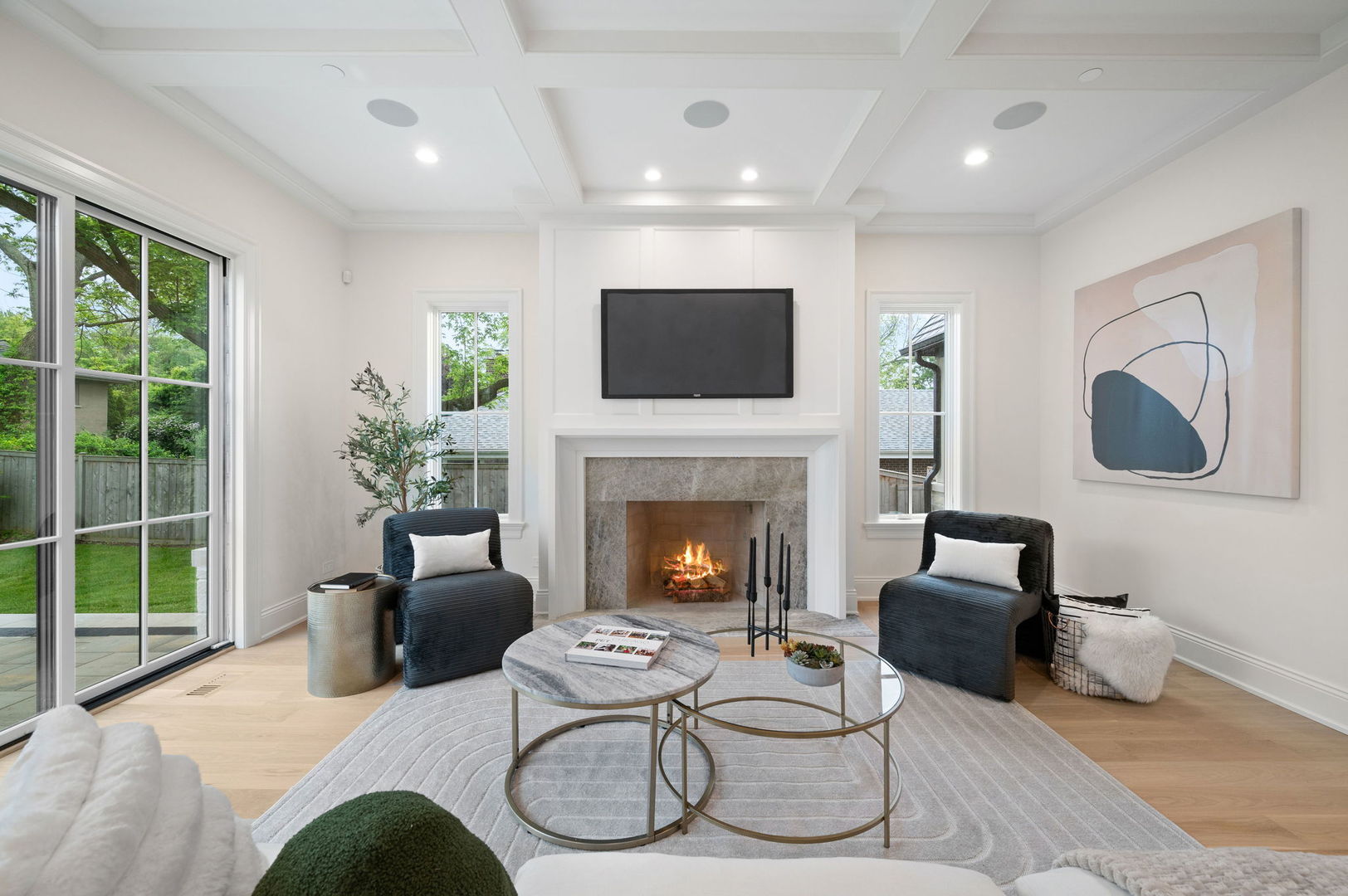 1171 Hohlfelder Road Glencoe, IL 60022 - Photo 16 of 56 a living room with furniture a fireplace and a flat screen tv