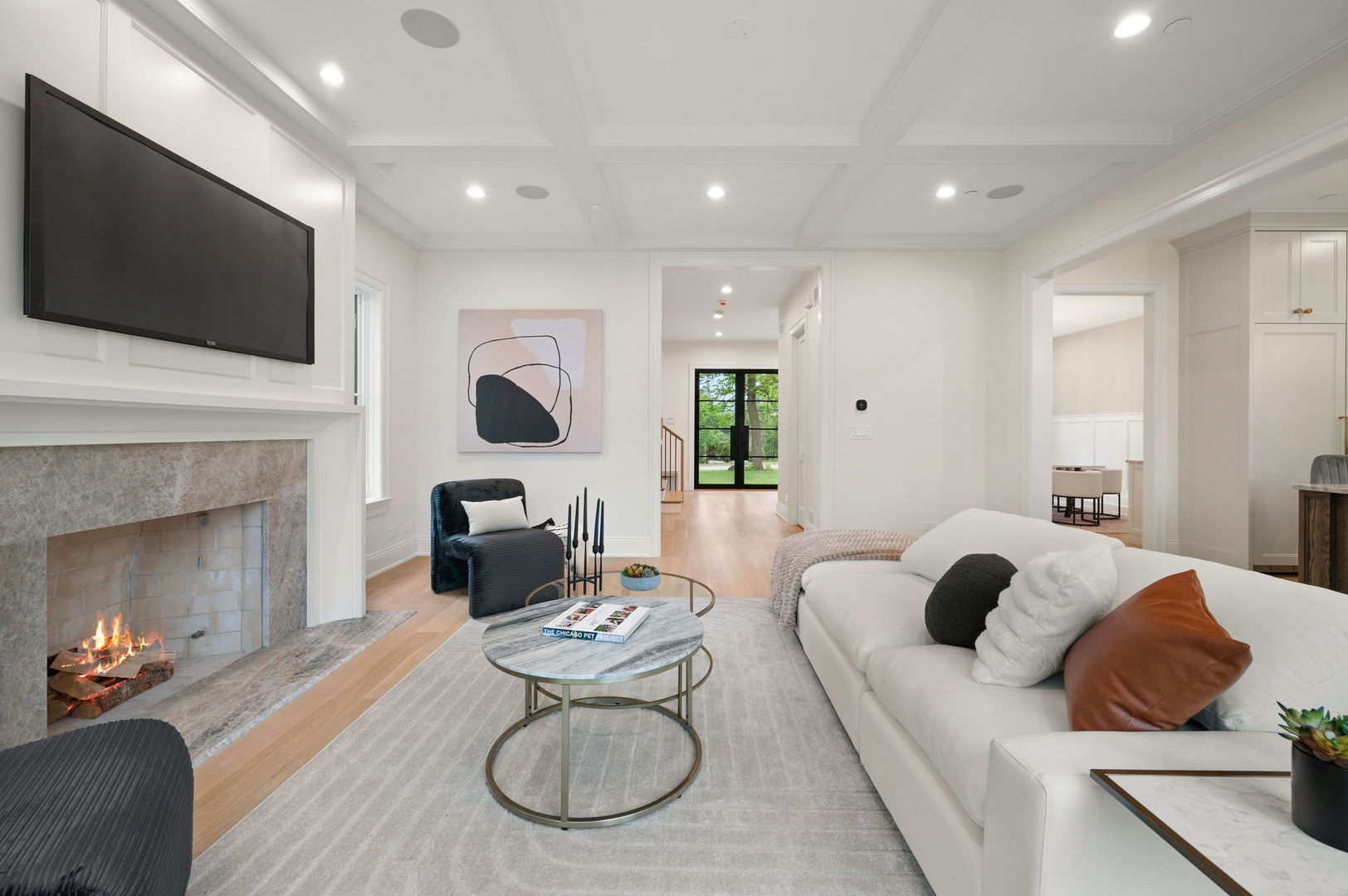 1171 Hohlfelder Road Glencoe, IL 60022 - Photo 17 of 56 a living room with furniture a fireplace and a flat screen tv