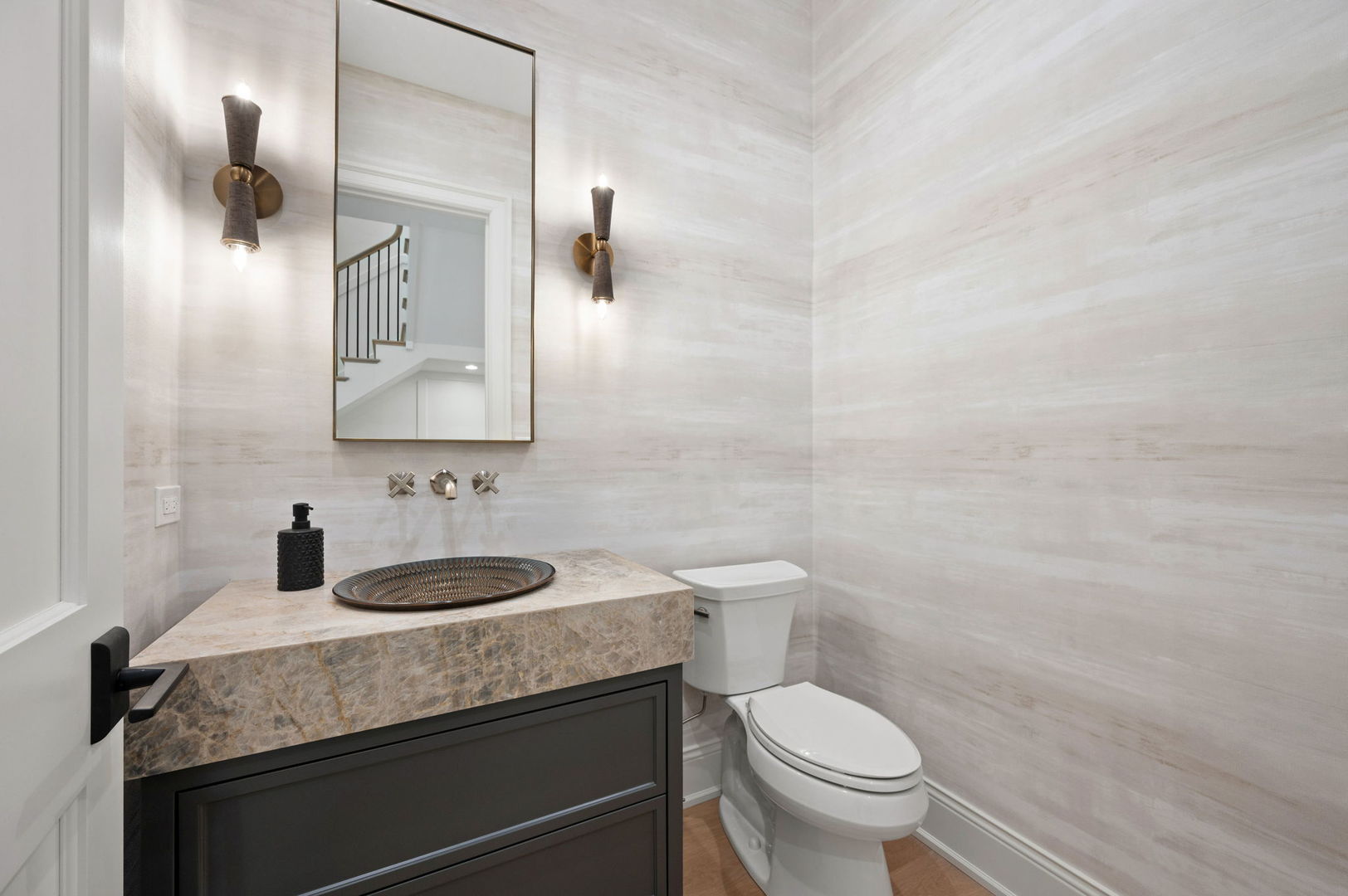 1171 Hohlfelder Road Glencoe, IL 60022 - Photo 21 of 56 a bathroom with a granite countertop toilet a sink and a mirror