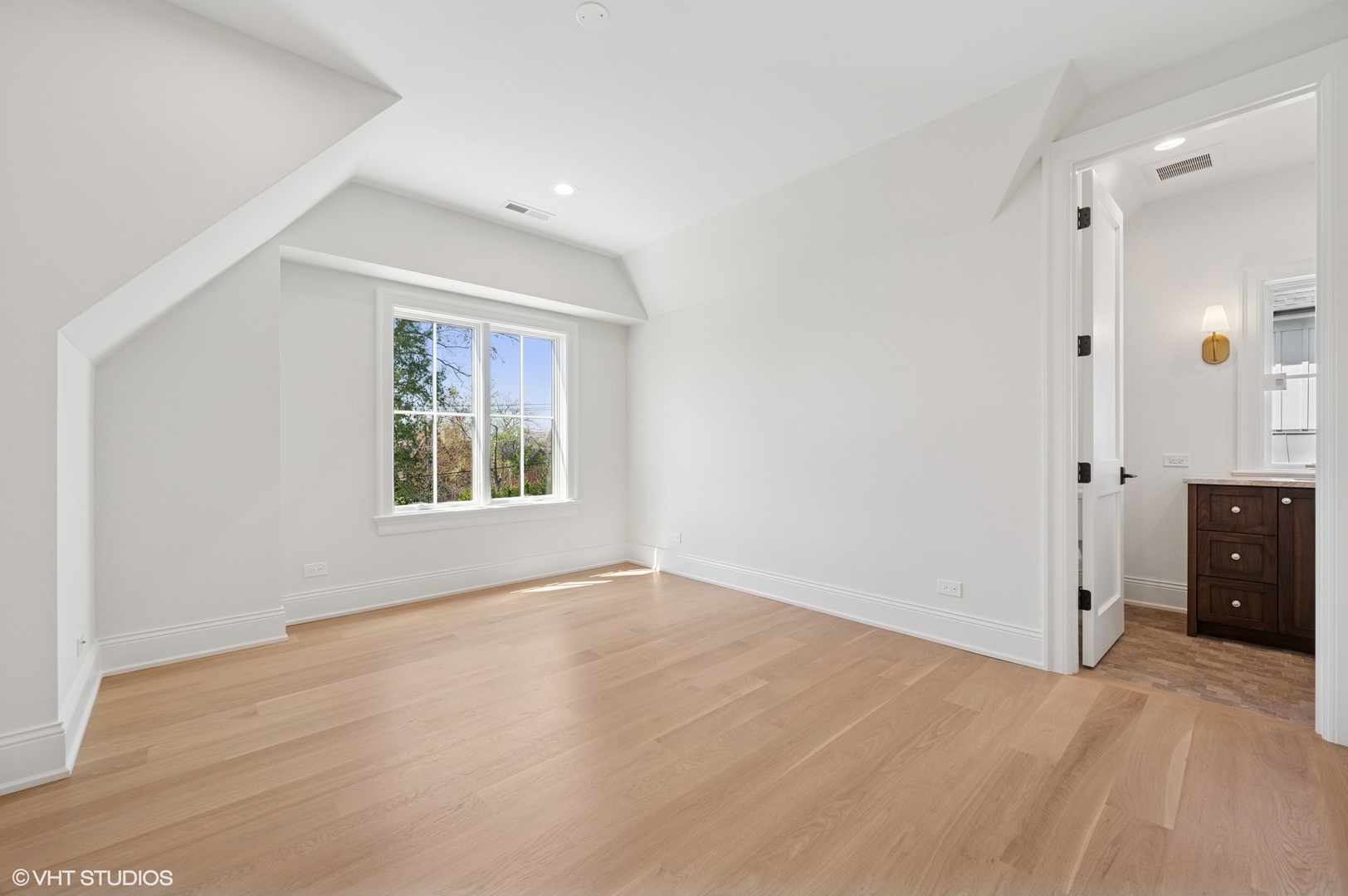 1171 Hohlfelder Road Glencoe, IL 60022 - Photo 31 of 56 a view of an empty room with window and hardwood floor