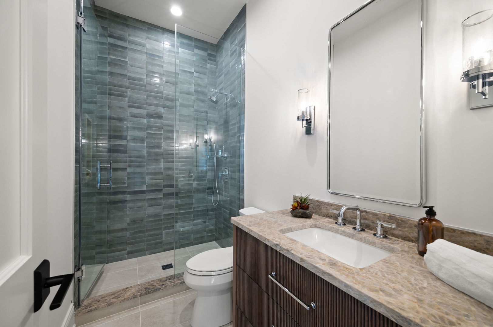 1171 Hohlfelder Road Glencoe, IL 60022 - Photo 41 of 56 a bathroom with a granite countertop sink a toilet a mirror and shower