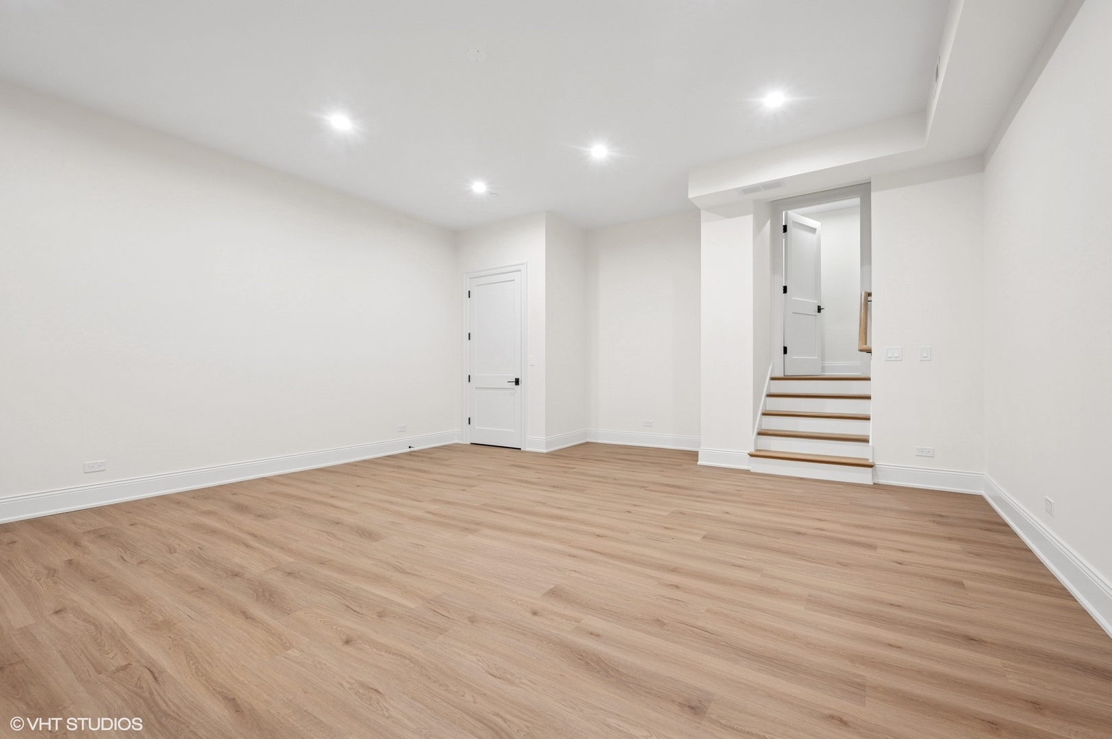 1171 Hohlfelder Road Glencoe, IL 60022 - Photo 45 of 56 a view of a big room with wooden floor and stairs