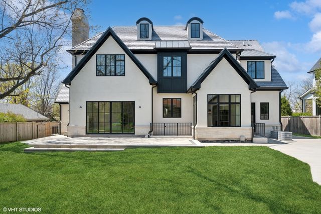 a front view of a house with a outdoor space