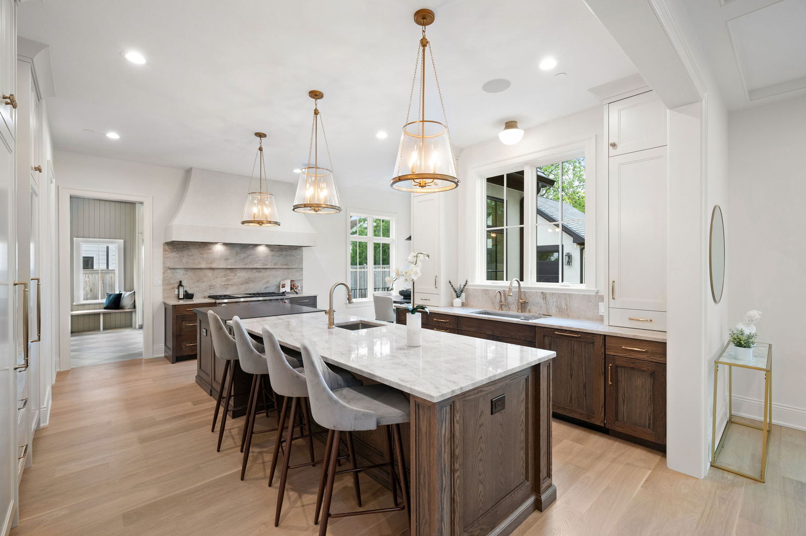 1171 Hohlfelder Road Glencoe, IL 60022 - Photo 9 of 56 a large kitchen with granite countertop lots of counter space dining table and stainless steel appliances