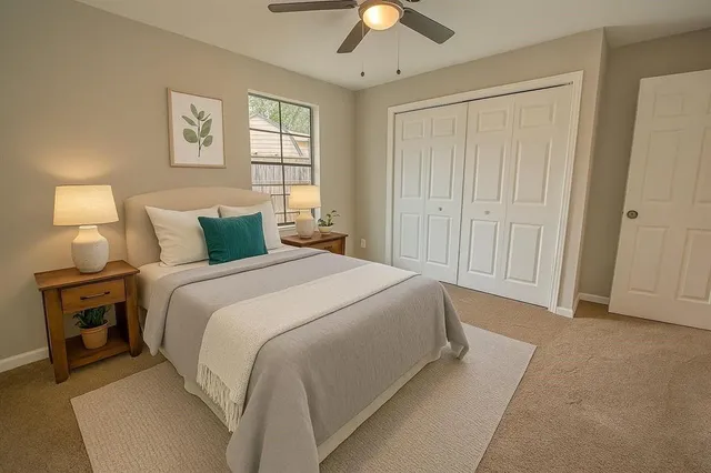 a bedroom with a bed and a lamp