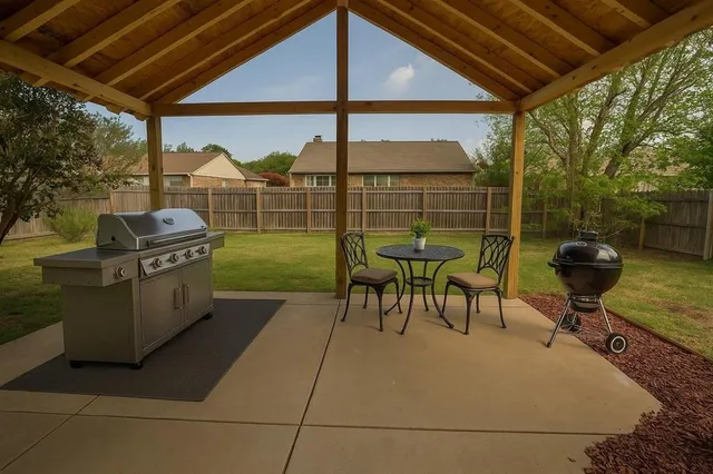 a view of a chairs and table in patio