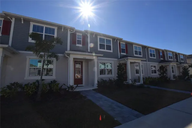 a front view of a house with yard