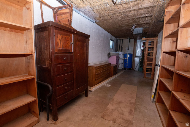 570 West Main Street Beaver, UT 84713 - Photo 29 of 43 Unfinished room featuring concrete flooring, exposed ceiling with woven material, light wood shelving, and a small window