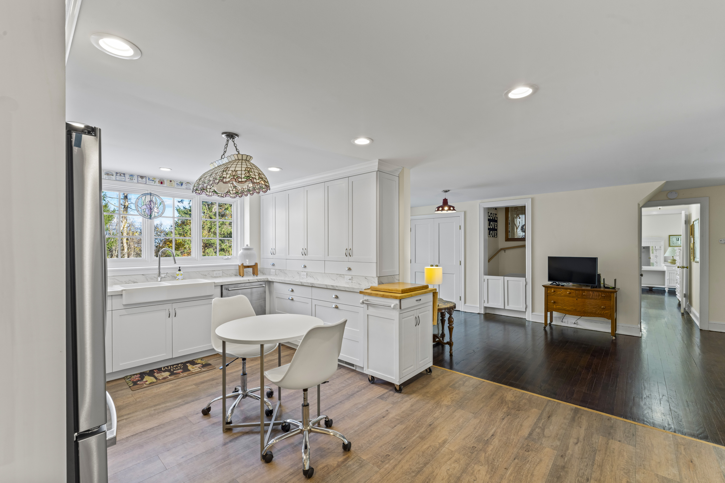 3 Topside Lane Newtown, CT 06470 - Photo 15 of 38 a kitchen with a dining table chairs and sink