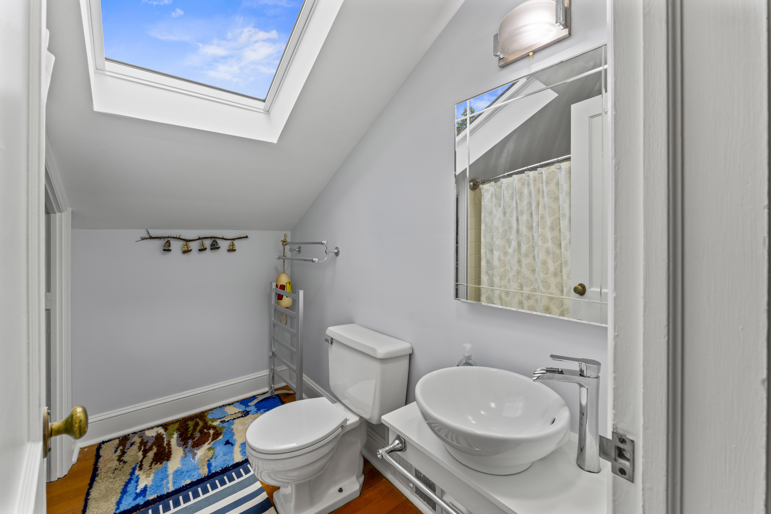 3 Topside Lane Newtown, CT 06470 - Photo 31 of 38 a white toilet sitting next to a bathroom sink and vanity