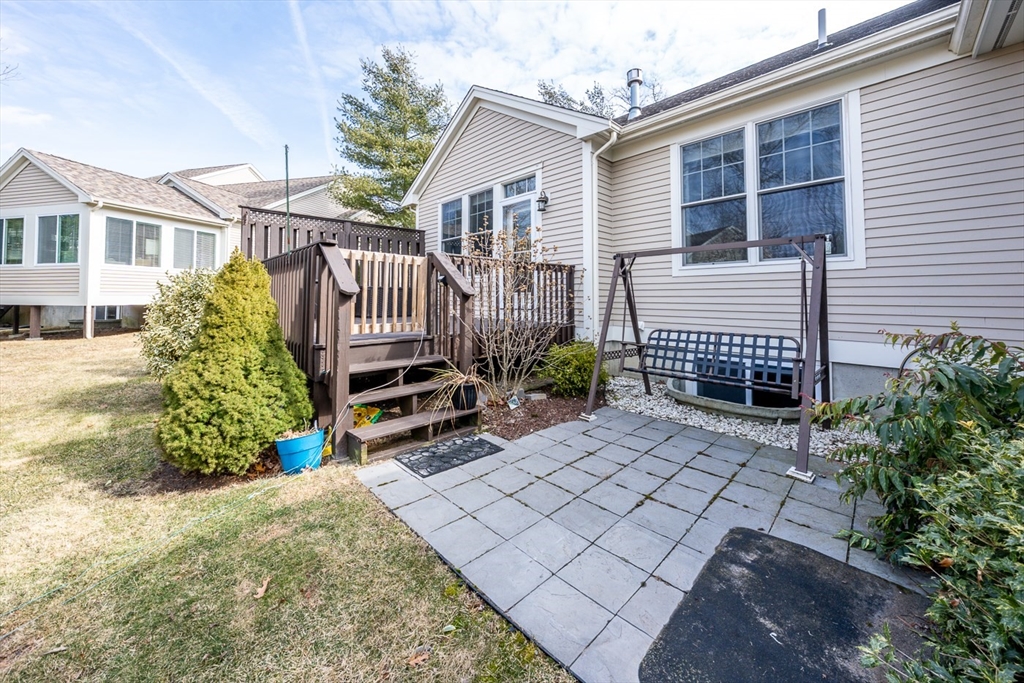 27 Grey Hawk Drive, Unit 628 Mashpee, MA 02649 - Photo 23 of 40 a front view of a house with a yard