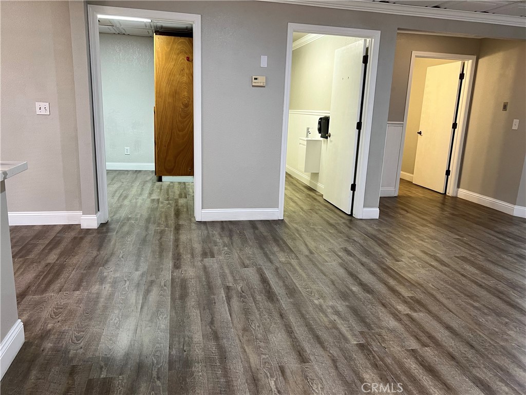 840 West Olive Avenue, Unit C Merced, CA 95348 - Photo 11 of 26 a view of a hallway with wooden floor