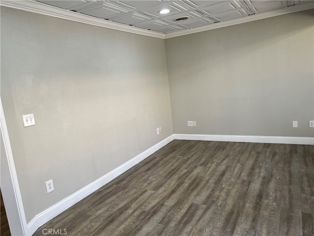 840 West Olive Avenue, Unit C Merced, CA 95348 - Photo 14 of 26 a view of a room with wooden floor