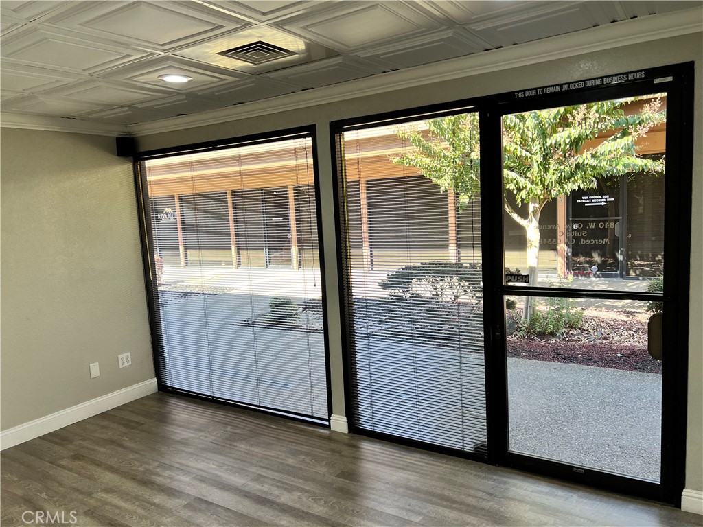 840 West Olive Avenue, Unit C Merced, CA 95348 - Photo 15 of 26 a view of a room with wooden floor and balcony