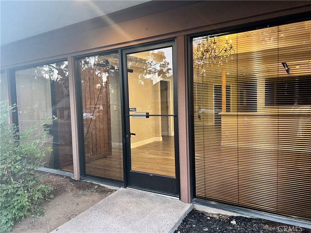 840 West Olive Avenue, Unit C Merced, CA 95348 - Photo 18 of 26 a view of a glass door with a door