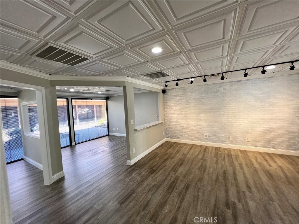 840 West Olive Avenue, Unit C Merced, CA 95348 - Photo 2 of 26 en empty room with wooden floor