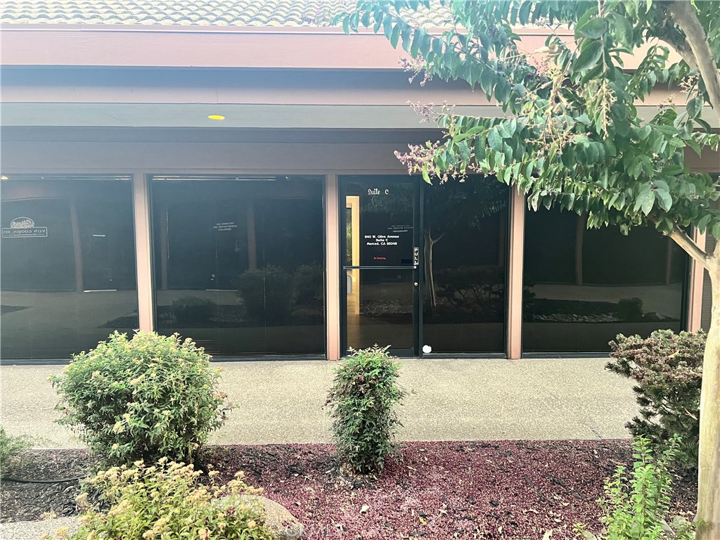 840 West Olive Avenue, Unit C Merced, CA 95348 - Photo 25 of 26 a view of a house with a yard