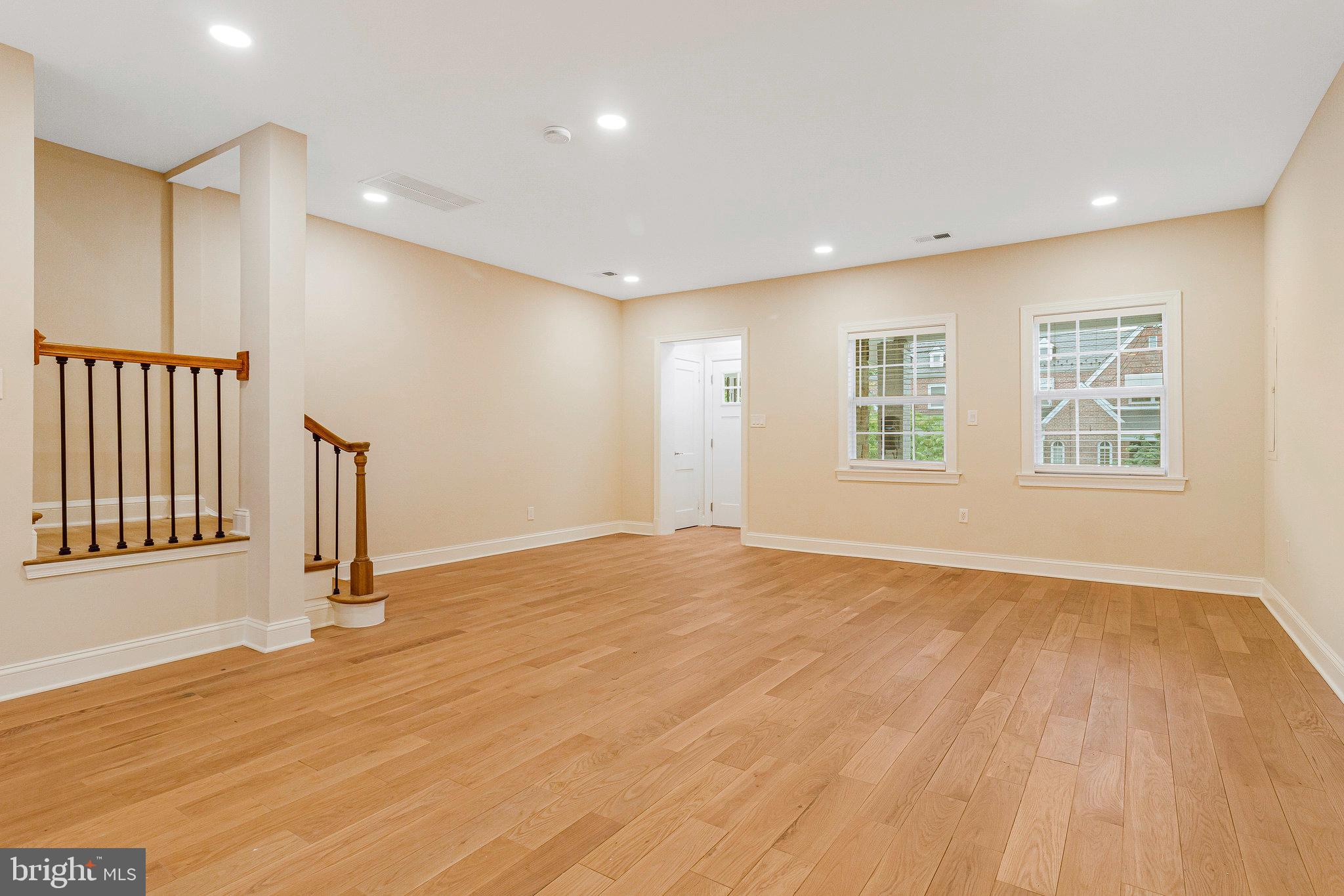 1350 Sheridan Street Northwest Washington, DC 20011 - Photo 11 of 55 a view of an empty room with wooden floor and a window