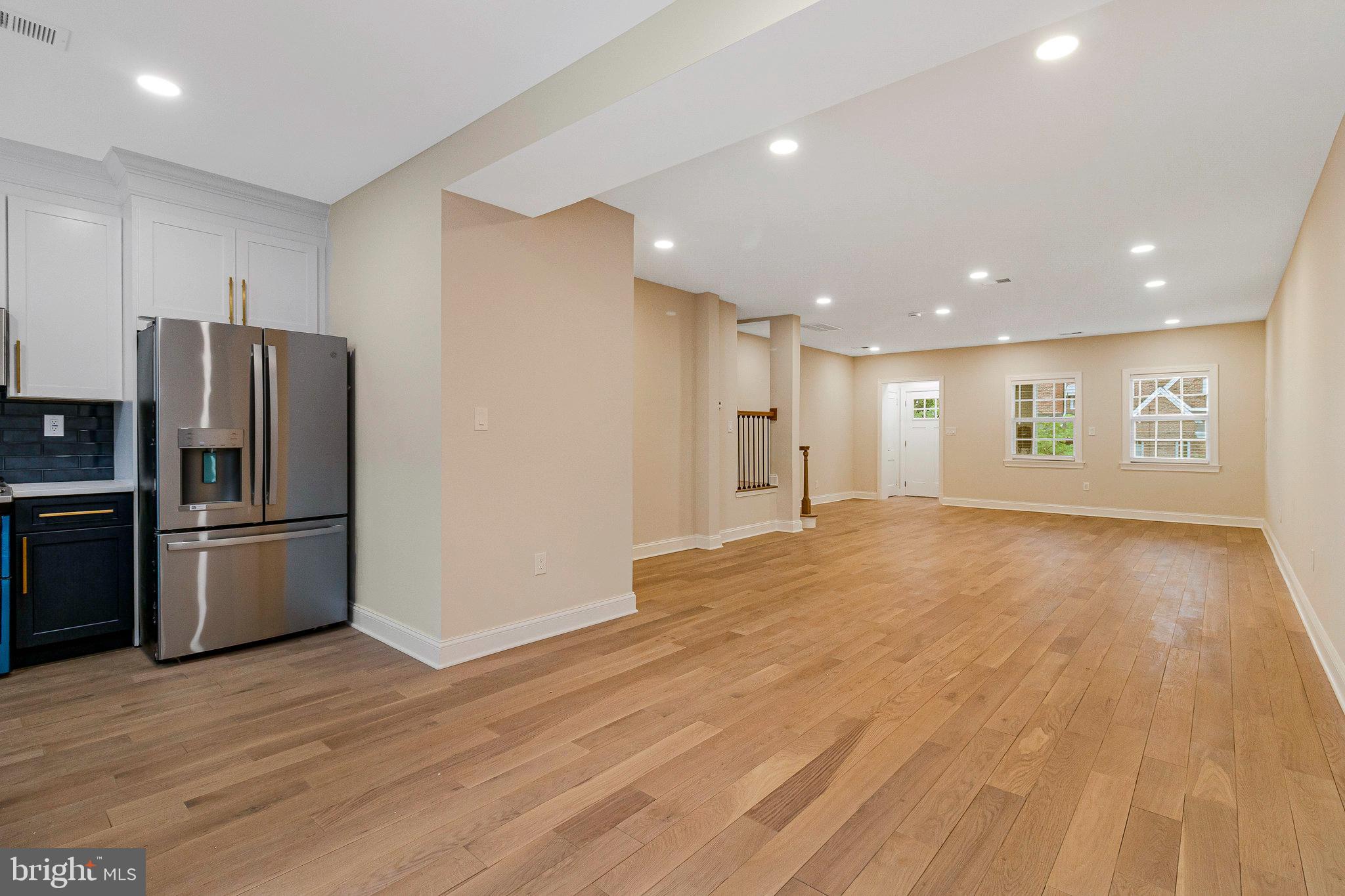 1350 Sheridan Street Northwest Washington, DC 20011 - Photo 16 of 55 a view of a kitchen with a refrigerator and wooden floor