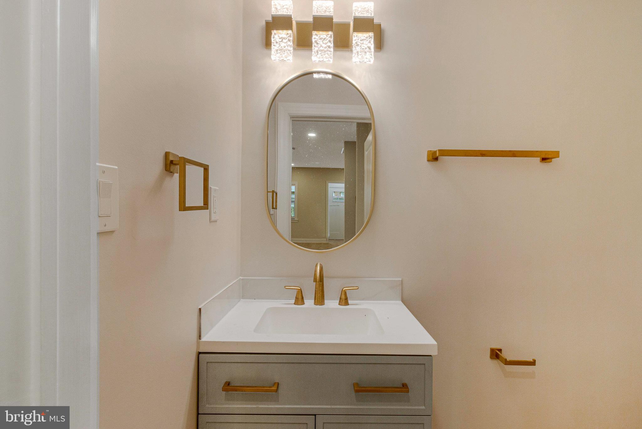 1350 Sheridan Street Northwest Washington, DC 20011 - Photo 18 of 55 a bathroom with a sink and a mirror