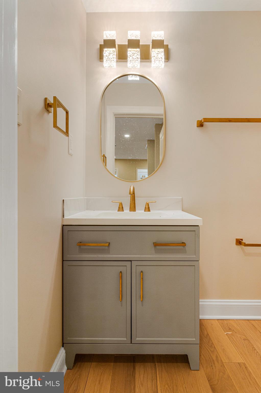 1350 Sheridan Street Northwest Washington, DC 20011 - Photo 19 of 55 a bathroom with a sink and a mirror