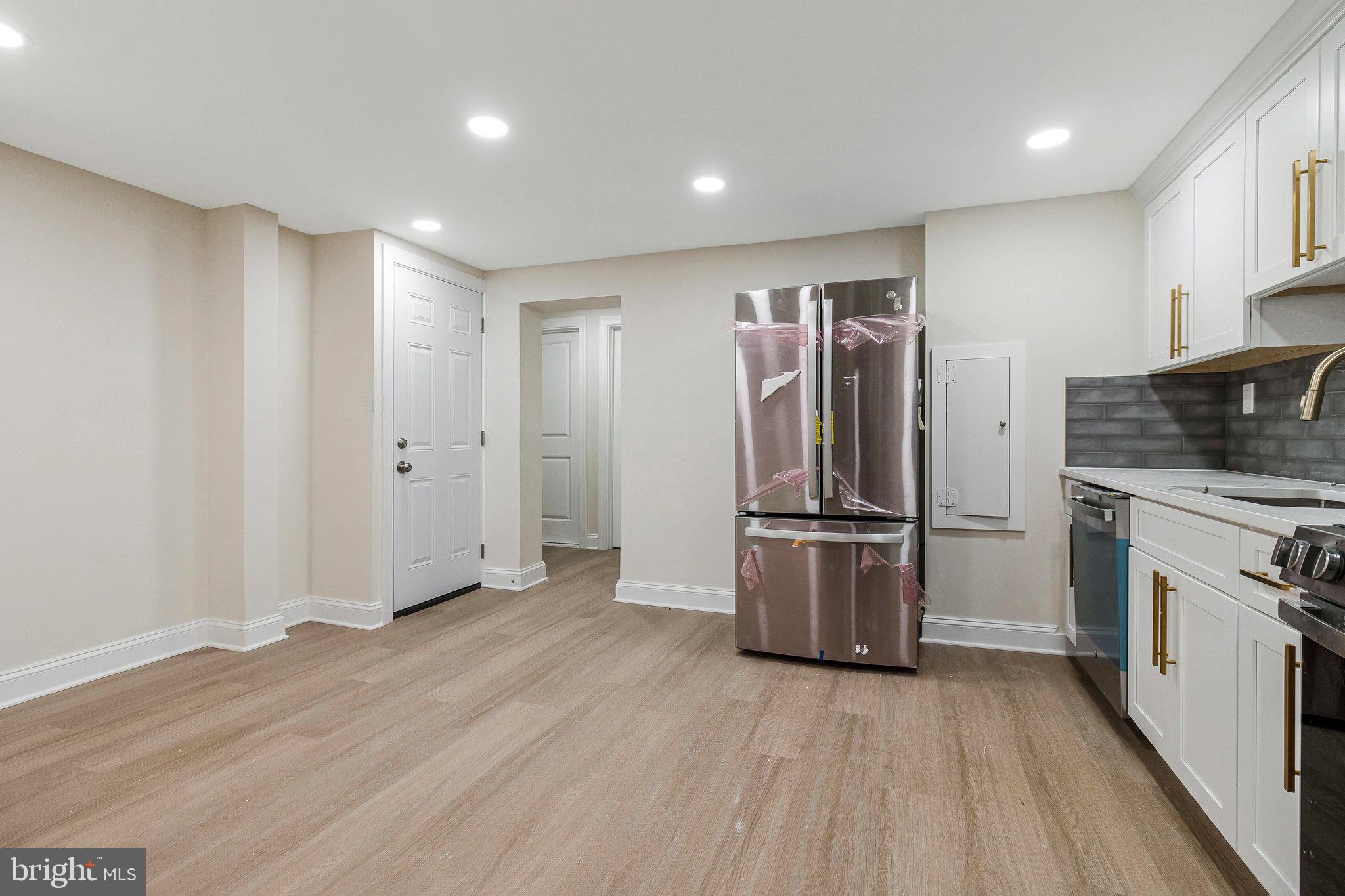 1350 Sheridan Street Northwest Washington, DC 20011 - Photo 45 of 55 a kitchen with stainless steel appliances granite countertop a refrigerator microwave and stove