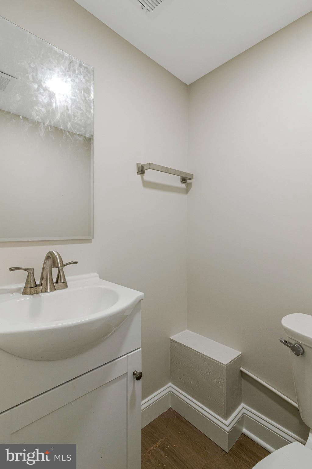 1350 Sheridan Street Northwest Washington, DC 20011 - Photo 49 of 55 a bathroom with a sink a toilet and vanity