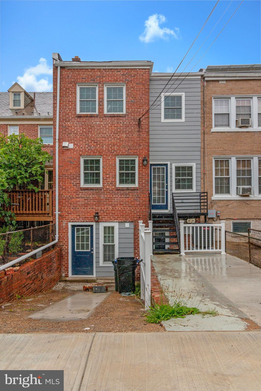 1350 Sheridan Street Northwest Washington, DC 20011 - Photo 52 of 55 a front view of a house with a yard