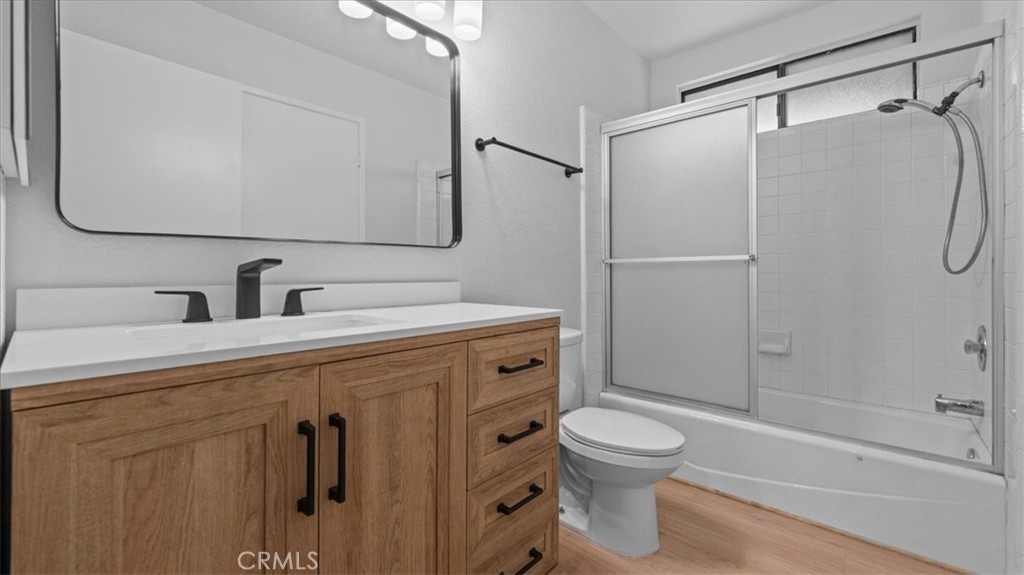 10720 Springfield Drive Rancho Cucamonga, CA 91730 - Photo 15 of 35 a bathroom with a toilet sink and shower