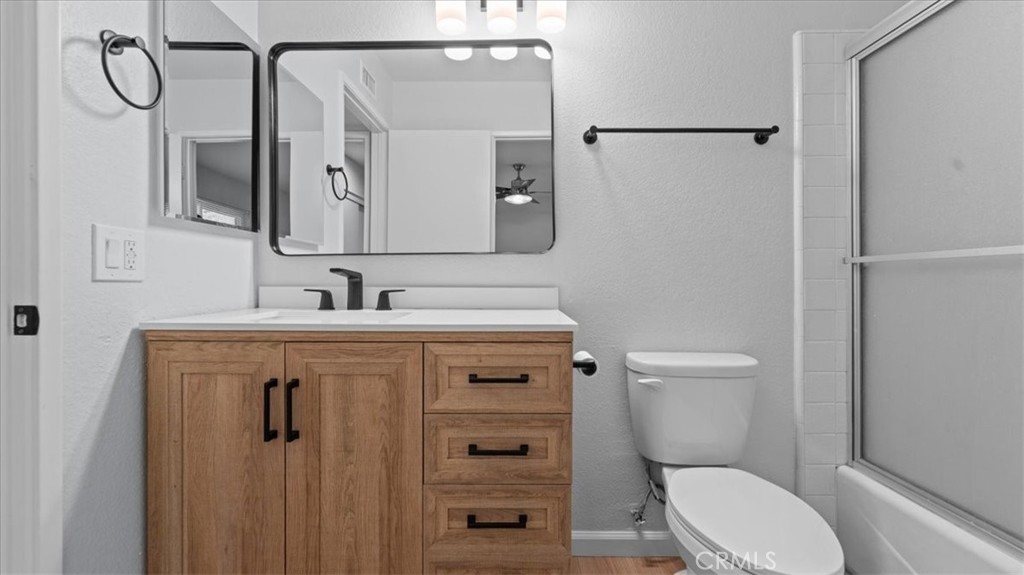 10720 Springfield Drive Rancho Cucamonga, CA 91730 - Photo 16 of 35 a bathroom with a granite countertop sink toilet and shower