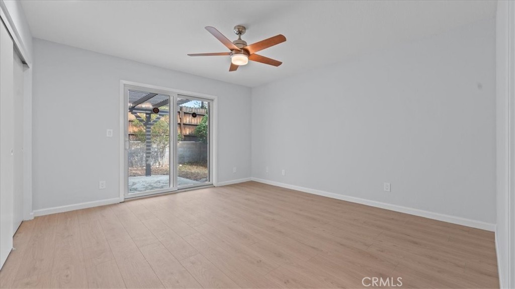 10720 Springfield Drive Rancho Cucamonga, CA 91730 - Photo 17 of 35 an empty room with fan and windows