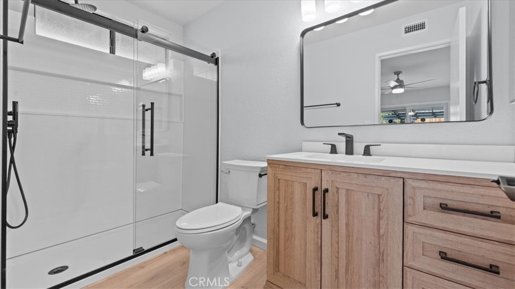 10720 Springfield Drive Rancho Cucamonga, CA 91730 - Photo 19 of 35 a bathroom with a toilet sink and shower