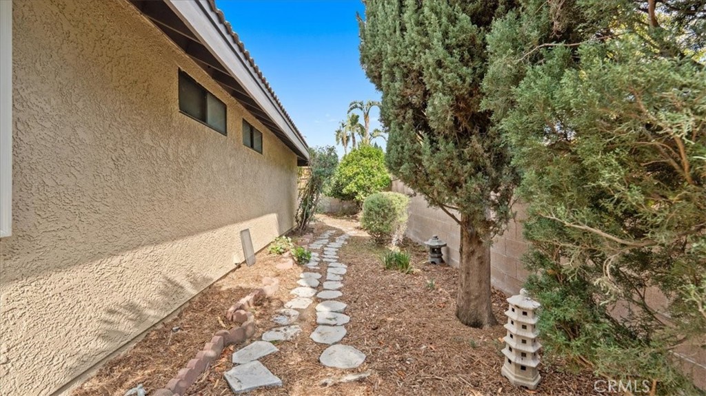 10720 Springfield Drive Rancho Cucamonga, CA 91730 - Photo 25 of 35 a view of a yard with plants and trees