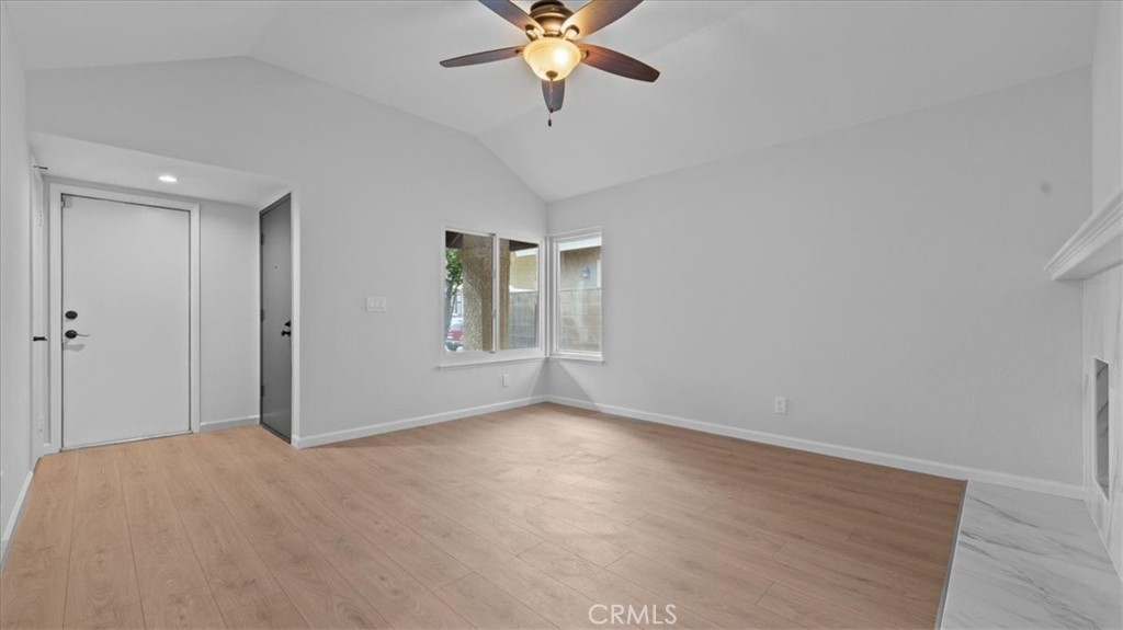 10720 Springfield Drive Rancho Cucamonga, CA 91730 - Photo 7 of 35 a view of a livingroom with a ceiling fan and window