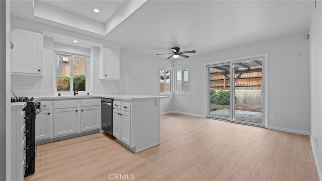 10720 Springfield Drive Rancho Cucamonga, CA 91730 - Photo 8 of 35 a view of a kitchen with a sink cabinets and wooden floor