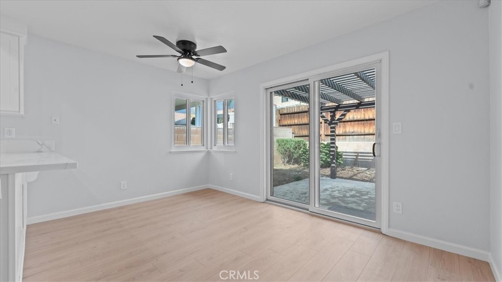 10720 Springfield Drive Rancho Cucamonga, CA 91730 - Photo 10 of 35 wooden floor in an empty room with a window