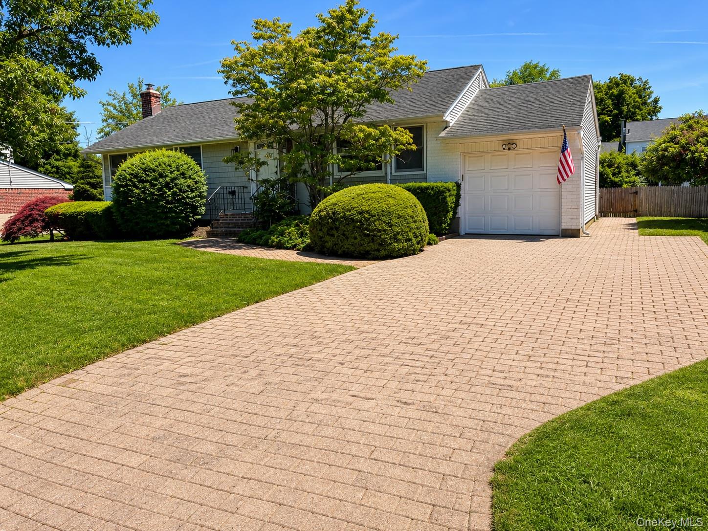 16 Clay Pitts Road Greenlawn, NY 11740 - Photo 2 of 25 Charming single-story residence featuring light-colored siding and a dark shingle roof
