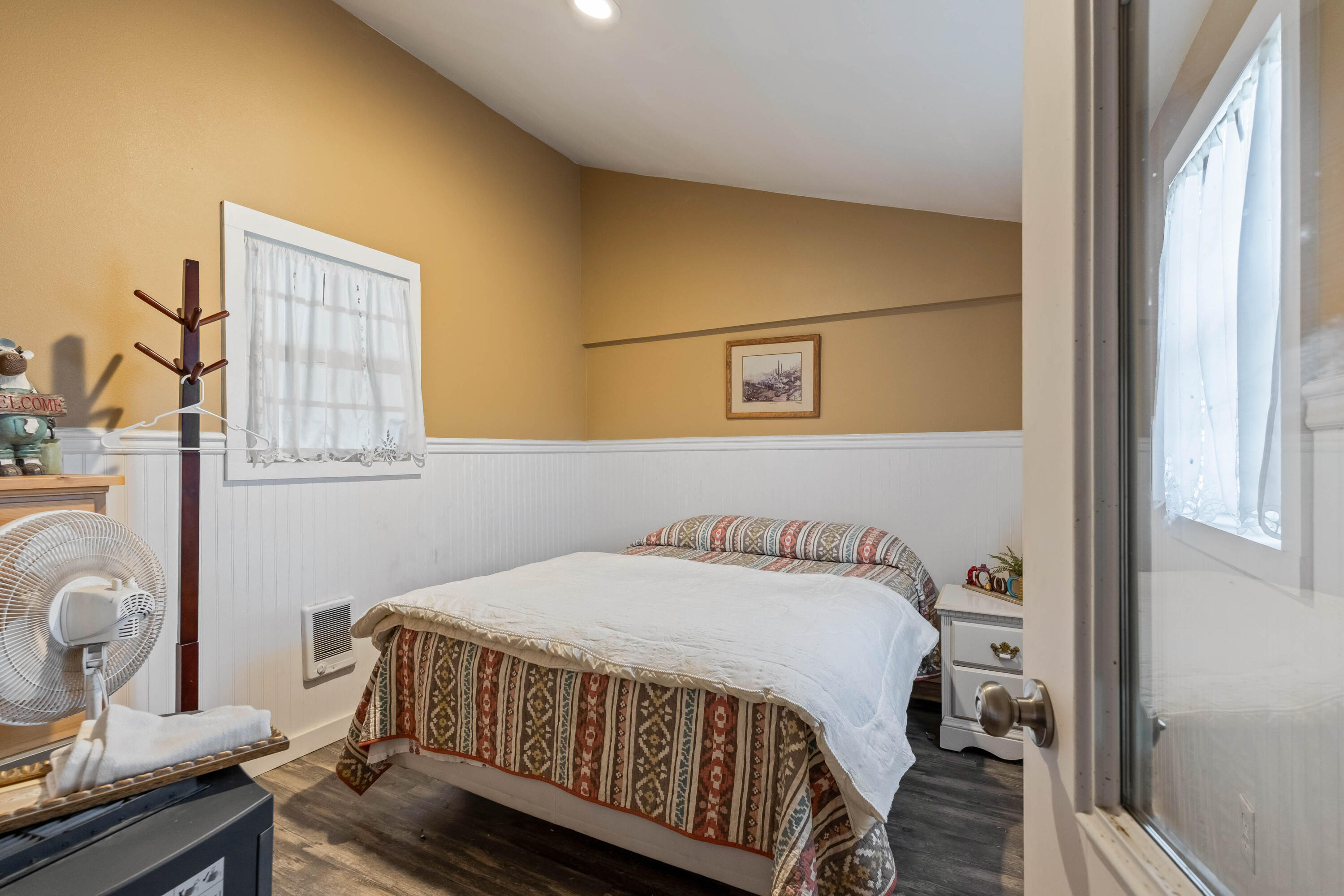 70030 Northwest Hunt Road Sisters, OR 97759 - Photo 31 of 55 a bedroom with a bed and wooden floor