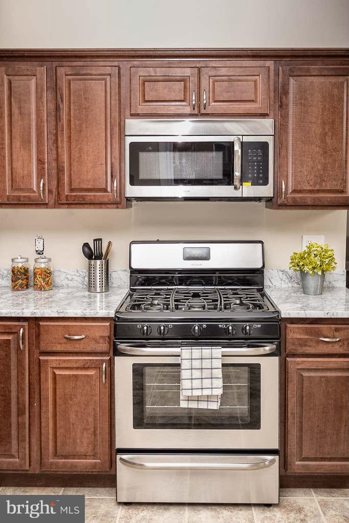3912 Chatham Road Baltimore, MD 21207 - Photo 14 of 30 Chef's Kitchen with Stainless Steel Appliances