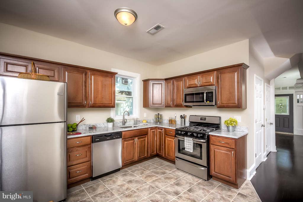 3912 Chatham Road Baltimore, MD 21207 - Photo 3 of 30 Chef's Kitchen with Stainless Steel and Marble
