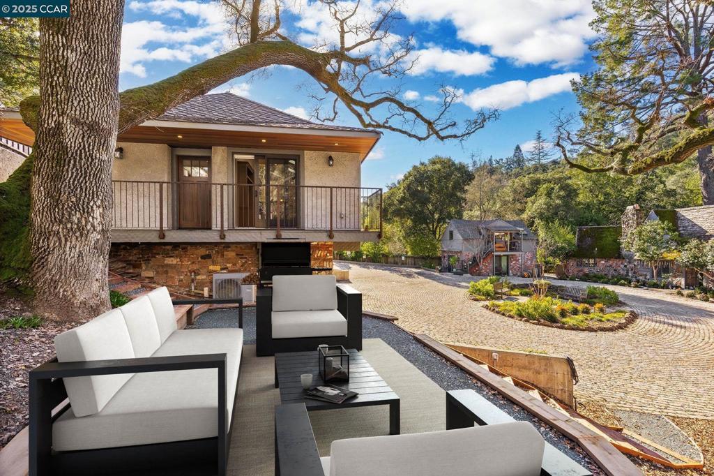 100 Moraga Way Orinda, CA 94563 - Photo 21 of 48 a view of a house with backyard and sitting area