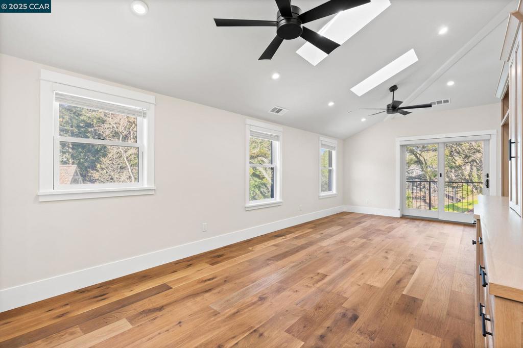 100 Moraga Way Orinda, CA 94563 - Photo 25 of 48 a view of an empty room with a window and wooden floor