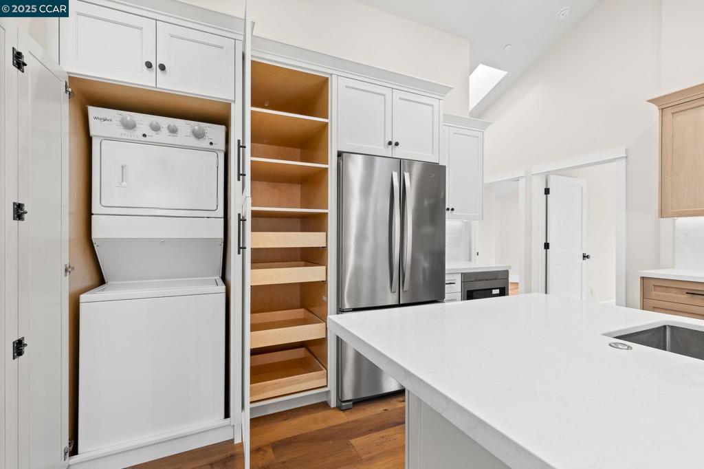 100 Moraga Way Orinda, CA 94563 - Photo 29 of 48 a kitchen with stainless steel appliances a refrigerator and cabinets